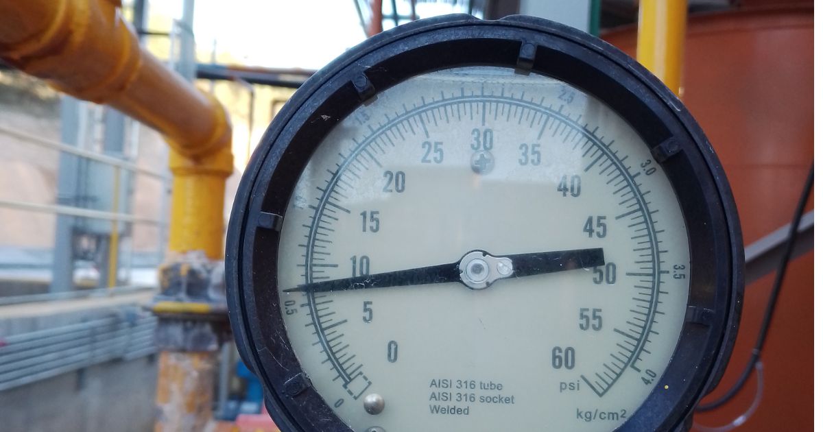 Industrial pump discharge pressure gauge during field inspection
